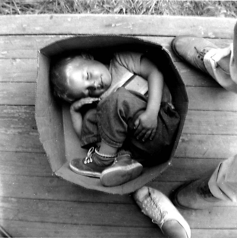 Boy asleep in cardboard box, Hooverville, ca. 1933. Photographer Victor Steinbrueck (c) Boy asleep in cardboard box, Hooverville, ca. 1933. Photographer Victor Steinbrueck